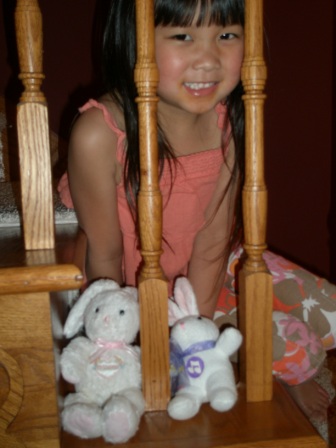 Kasen with bunnies on the stairs